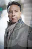 Business Man wearing a grey Coat and Scarf  