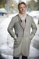 Business Man wearing a grey Coat and Scarf  