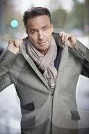 Business Man wearing a grey Coat and Scarf  