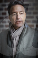 Business Man wearing a grey Coat and Scarf  