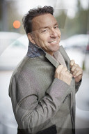 Business Man wearing a grey Coat and Scarf  