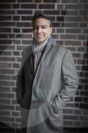 Business Man wearing a grey Coat and Scarf  