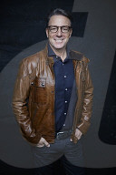 Mature Man wearing a brown Leather Jacket 