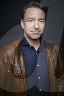 Mature Man wearing a brown Leather Jacket 