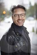 Mature Man wearing a black Leather Jacket  