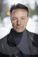 Mature Man wearing a black Leather Jacket  
