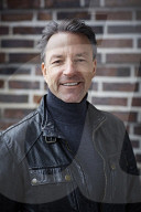 Mature Man wearing a black Leather Jacket  