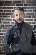 Mature Man wearing a black Leather Jacket  