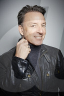 Mature Man wearing a black Leather Jacket  