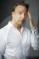 Mature Man wearing a wihte Shirt  