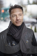 Mature Man wearing a black Leather Jacket  
