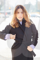  Woman wearing a black Coat 