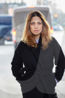  Woman wearing a black Coat 