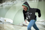 Young man running in swiss alps-panorama