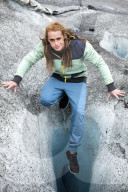 Young man on a glacier crevasse