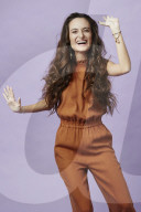 Young Woman wearing a Jumpsuit laughing out loud