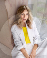 Smiling Woman sitting on the Floor 
