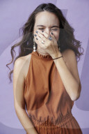 Young Woman wearing a Jumpsuit laughing