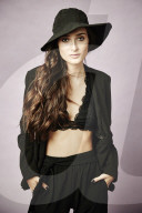  Young Woman wearing black Outfit and Hat 