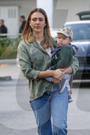 Jessica Alba glows while carrying her son Hayes after going Thanksgiving shopping at Bristol Farms!
