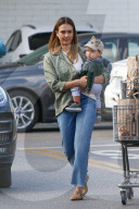 Jessica Alba glows while carrying her son Hayes after going Thanksgiving shopping at Bristol Farms!