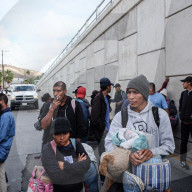 Migrants try to enter the US