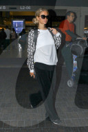 PREMIUM EXCLUSIVE Paris Hilton Returns From Cancun With A Glowing Tan
