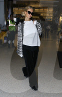 PREMIUM EXCLUSIVE Paris Hilton Returns From Cancun With A Glowing Tan