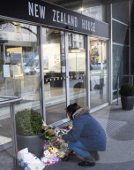 Floral tributes are left outside the High Commission of New Zealand in London in the wake of the terror attacks on two mosques 14th March 2019.

15th March 2019.