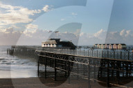 The battle of Hastings pier has erupted in public insults and accusations after a decision to close the seaside town’s prize-winning attraction .Furious locals have accused owner Sheikh Abid Gulzar of keeping them in the dark over his plans for the pier?