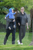 Rosie Huntington-Whiteley and Jason Statham look very much in love as the doting parents step out for an afternoon walk with their son Jack