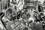 On the day Britain is supposed to leave the EU, a large crowd of leavers from all over the country gather in front of the Houses of Parliament. The atmosphere is bon enfant, with a small representation of french campaigning for frexit.