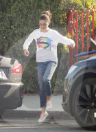 Mila Kunis show some jumping skills as she head back to her car after running errands in Los Angeles