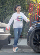 Mila Kunis show some jumping skills as she head back to her car after running errands in Los Angeles