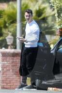 Kevin Jonas is seen chatting on his phone as he arrived at at a friends house in Los Angeles. 