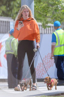 Ireland Baldwin is seen sharing her Chick-fil-A burger with one of her dogs as she is spending time with her musician boyfriend Corey Harper.