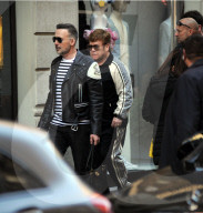 Milan, Elton John and husband David Furnish shopping downtown