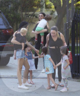 Mila Kunis flashes a big smile while carrying her son Dimitri after attending a Mommy and Me Class in Studio City!