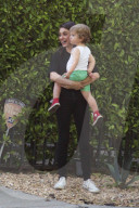 Mila Kunis flashes a big smile while carrying her son Dimitri after attending a Mommy and Me Class in Studio City!