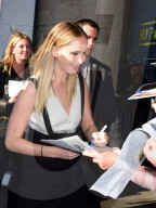 Jennifer Lawrence  signs for fans as she arrives for her talk with director David O Russell at the Stella Artois Theater at Tribeca Film Festival on April 27, 2019 in New York city.
