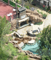 Stunning new aerial photos of DrakeÍs LA mansion show how heÍs turned the property into his very own Playboy-style grotto. 