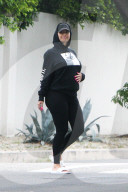 Pregnant Amber Rose pops out to some run errands in slides, yoga pants and a hoodie with her nails painted hot pink
