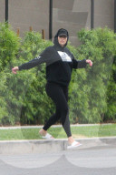 Pregnant Amber Rose pops out to some run errands in slides, yoga pants and a hoodie with her nails painted hot pink