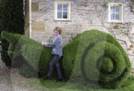 Shear genius! Meet the amateur topiarists who devote years to crafting incredible sculptures from their garden hedges.