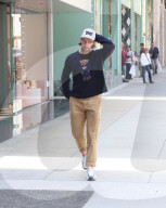PREMIUM EXCLUSIVE Patrick Schwarzenegger Confidently Rocks A Teddy Bear Sweater In Beverly Hills