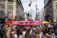 Thousands block roads in Extinction Rebellion protests across London.