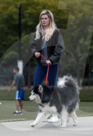 Ireland Baldwin and her boyfriend singer/songwriter Corey Harper are seen leaving a park with her dog in Los Angeles.