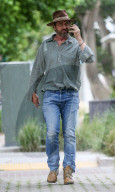 Gerard Butler is seen on the phone as he arrive at Starbucks in Malibu. 