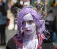 Cos Play enthusiasts arrive at Comic Con London dressed in the favourite cos play costumes.