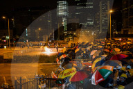 Hong Kongers storm the Legislature, Police retaliate with tear gas